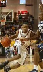 Troy Bell scores 29 points on St. John's including a 3-pointer to win the game.