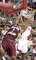 Craig Smith scores despite the defensive effort of Temple's Nile Murry during the first half of a second-round NIT game in Philadelphia.