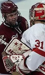 Forward Ben Eaves congratulates Cornell goaltender David LeNeveu after Cornell defeated Boston College 2-1.