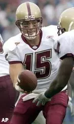 Quinton Porter hands the ball off during the second half.