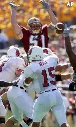 Ball State quarterback Talmadge Hill has his pass batted down by Jake Ottolini and Mathias Kiwanuka.