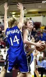 Boston College's Maureen Leahy, right, fights her way to the basket around Seton Hall's Heta Korpivaara during the first half in Boston.