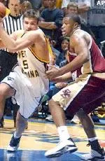 Smith plays defense as West Virginia's Johannes Herber tries to drive into the lane.