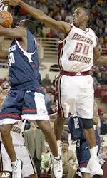 Uka Agbai swats away the layup attempt of UConn center Emeka Okafor.