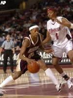 Aja Parham drives past Massachusetts' Brooke Campbell during the first half.