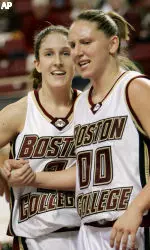 Jessalyn Deveny is congratulated by Sarah Marshall after drawing a charging foul against New Hampshire.