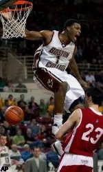 Craig Smith celebrates his dunk over Boston University's Tony Gaffney.