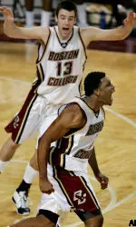 Craig Smith, bottom, yells after hitting the game-winning basket at the buzzer.