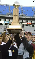 BC head coach Tom O'Brien holds up the trophy after his team's 37-24 win over UNC in the Continental Tire Bowl.