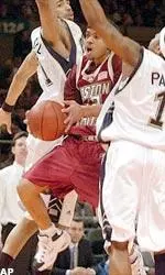 Steve Hailey drives to the basket as he splits two Pittsburgh defenders.