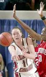 Kathrin Ress passes the ball away as an Ohio State player defends.