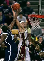 Sean Marshall drives hard to the basket as Villanova guard Randy Foye tries for the block during the first half.