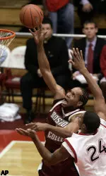 Jermaine Watson, left, puts up a shot against St. John's Dexter Gray.