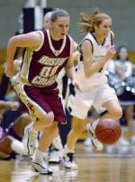 Jessalyn Deveny takes the ball upcourt after Aja Parham stole the ball from Providence's All Gard during the first half.