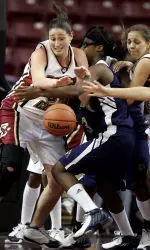 Lisa Macchia, left, and Kindyll Dorsey, right, battle for a loose ball with Pittsburgh's Jennifer Brown.