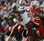 Boston College running back Andre Callender, left, stretches his arms out as he scores a touchdown while dragging Maryland saftey Milton Harris, back, and being chased by linebacker D'Qwell Jackson (52) during the first quarter Saturday, Nov. 19, 2005 in College Park, Md. (AP Photo/Chris Gardner)