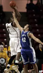 Craig Smith, left, shoots over Shawnee State's Bryan Robinson (42) (AP Photo)