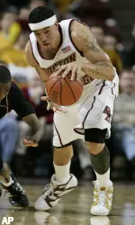 Boston College's Sean Marshall gathers in a loose ball in front of Texas Southern's Curtis Smith during the first half of college basketball at Conte Forum in Boston, Sunday, Dec. 18, 2005. (AP Photo/Winslow Townson)