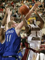Seton Hall's Grant Billmeier tries to block Craig Smith as he drives toward the basked in the first half.