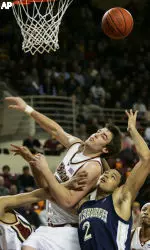 Nate Doornekamp, left, struggles with Pittsburgh's Chevon Troutman (2) for the loose rebound.