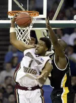 Craig Smith pulls down a rebound in front of Wisconsin-Milwaukee's Joah Tucker in the second half.