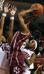 Aja Parham shoots over North Carolina State's Khadijah Whittington (1) and Billie McDowell (13) in the first half. (AP Photo/Sara D. Davis)