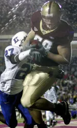 Jon Loyte catches a touchdown pass in the second quarter. (AP Photo/Adam Hunger)