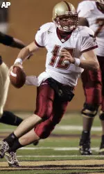 Matt Ryan runs for yardage in the first quarter. (AP Photo/Chuck Burton)