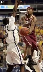 Tyrese Rice, right, leaps up to get a pass around Villanova's Shane Clark during the second half.