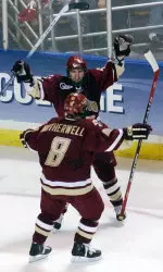 Joe Rooney celebrates his goal with teammate Brett Motherwell in the second period. (AP Photo/Lisa Poole)