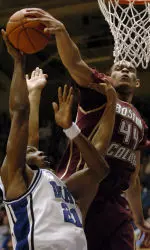 Tyrelle Blair blocks Duke's DeMarcus Nelson in the first half. (AP Photo/Sara D. Davis)