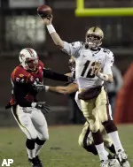 Boston College quarterback Matt Ryan throws under pressure from Maryland linebacker Adrian Moten.(AP Photo/Nick Wass)