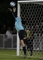 Junior Sarah Buonomo goes up for a huge save in the shootout of the first round game against UConn. The Huskies won in the PK session to advance to the second round.