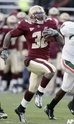 Andre Callender runs for a touchdown pursued by Miami's Randy Phillips (6) and Glenn Sharpe (4) in the fourth quarter. (AP Photo/Michael Dwyer)