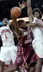Boston College's Corey Raji, center, drives to the basket against Maryland's Landon Miilbourne, left, and Bambale Osby, right.