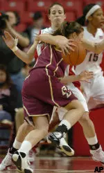 Ayla Brown drives to the hoop against Maryland's Shay Doron during the second half. (AP Photo/Gail Burton)