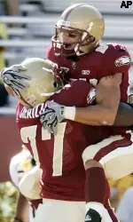 Boston College's Kevin Challenger, top, celebrates his touchdown with Gosder Cherilus (77) in the first quarter of a football game against Wake Forest, Saturday, Sept. 1, 2007, in Boston. (AP Photo/Michael Dwyer)