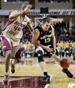 Tyrelle Blair dislodges the ball from Wake Forest's Chas McFarland in the first half in Boston. (AP Photo/Michael Dwyer)