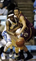 Ayla Brown battles for a loose ball during the first half.
