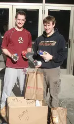 Members of the BC Fencing Team Show Their Food Drive Collection