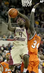 Tyrese Rice goes to the basket against the defense of Virginia Tech's Cheick Diakite (34) as Virginia Tech's Malcolm Delaney (23) looks on during the second half. (AP Photo/Mary Schwalm)