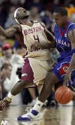 Kansas' Russell Robinson fouls Tyrese Rice in the first half. (AP Photo/Michael Dwyer)