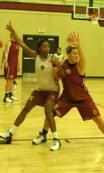 Lauren Whitehurst and Stefanie Murphy battling in the post at practice.
