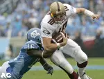 North Carolina's Kendric Burney tackles quarterback Chris Crane. (AP)