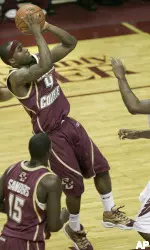 Tyrese Rice gets off a shot as Florida State's Ryan Reid rushes to defend in the first half Saturday, in Tallahassee, Fla. (AP Photo/Steve Cannon)
