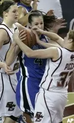 Mickel Picco and Stefanie Murphy sandwich Duke guard Abby Waner as they try to force a turnover during the second half.