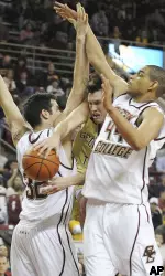 Georgia Tech's Matt Causey is sandwiched between John Oates, left, and Tyrelle Blair, right, during the first half. (AP Photo/Lisa Poole)
