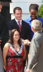 Matt Greene receives a congratulatory handshake from U.S. President George W. Bush