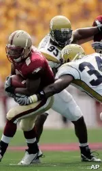 Jeff Smith moves to evade Georgia Tech's Steven Sylvester in the second quarter. (AP Photo/Michael Dwyer)