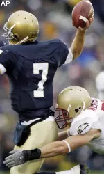 Notre Dame quarterback Jimmy Clausen is hit by Boston College linebacker Mike Morrissey in the second quarter.